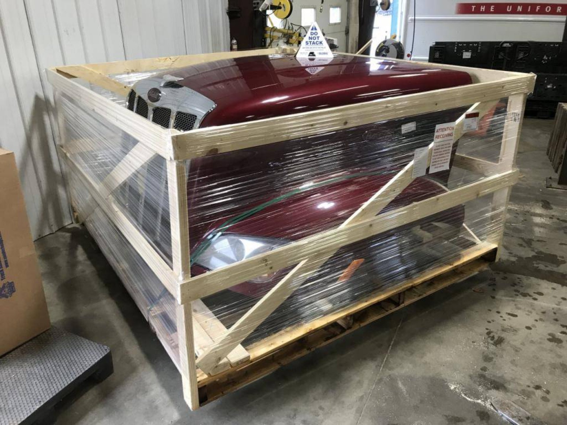 Crated truck hood packaged for freight shipping