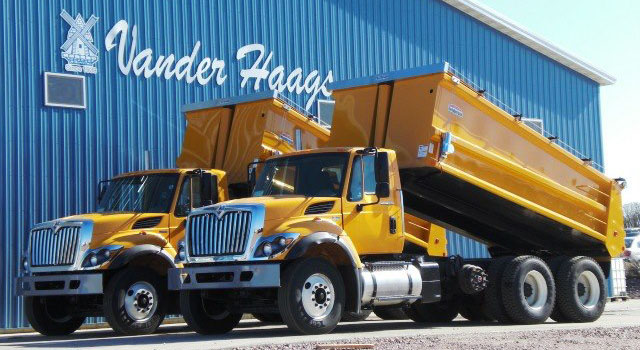 Grain trucks parked outside the Vander Haag's building